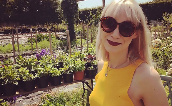 Maxine wearing sunglasses in a garden