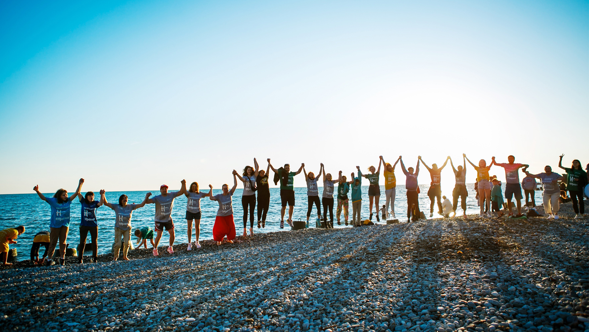 Svetlana Izambaeva Foundation staff jumping on the beach