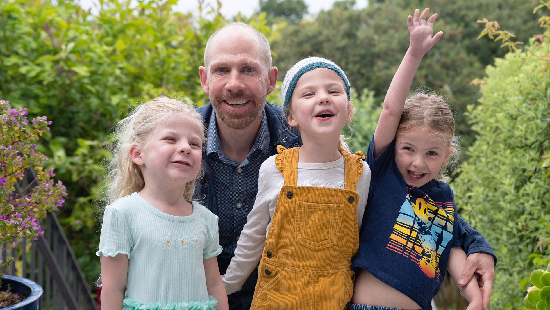 photo of Joel Silver and his triplet daughters